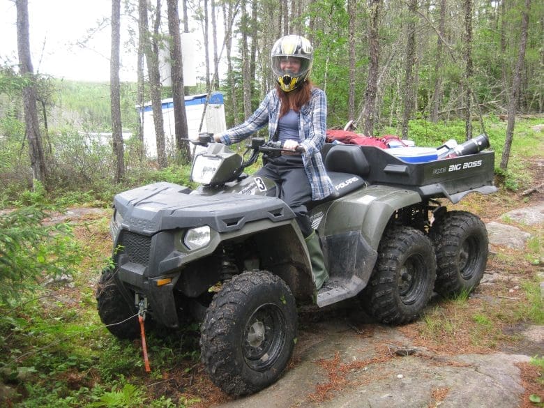 Female scientist on ATV at IISD Experimental Lakes Area in Ontario