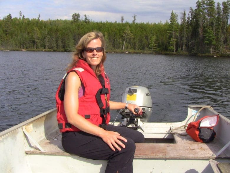 Karen Kidd out on a boat on a lake at IISD Experimental Lakes Area