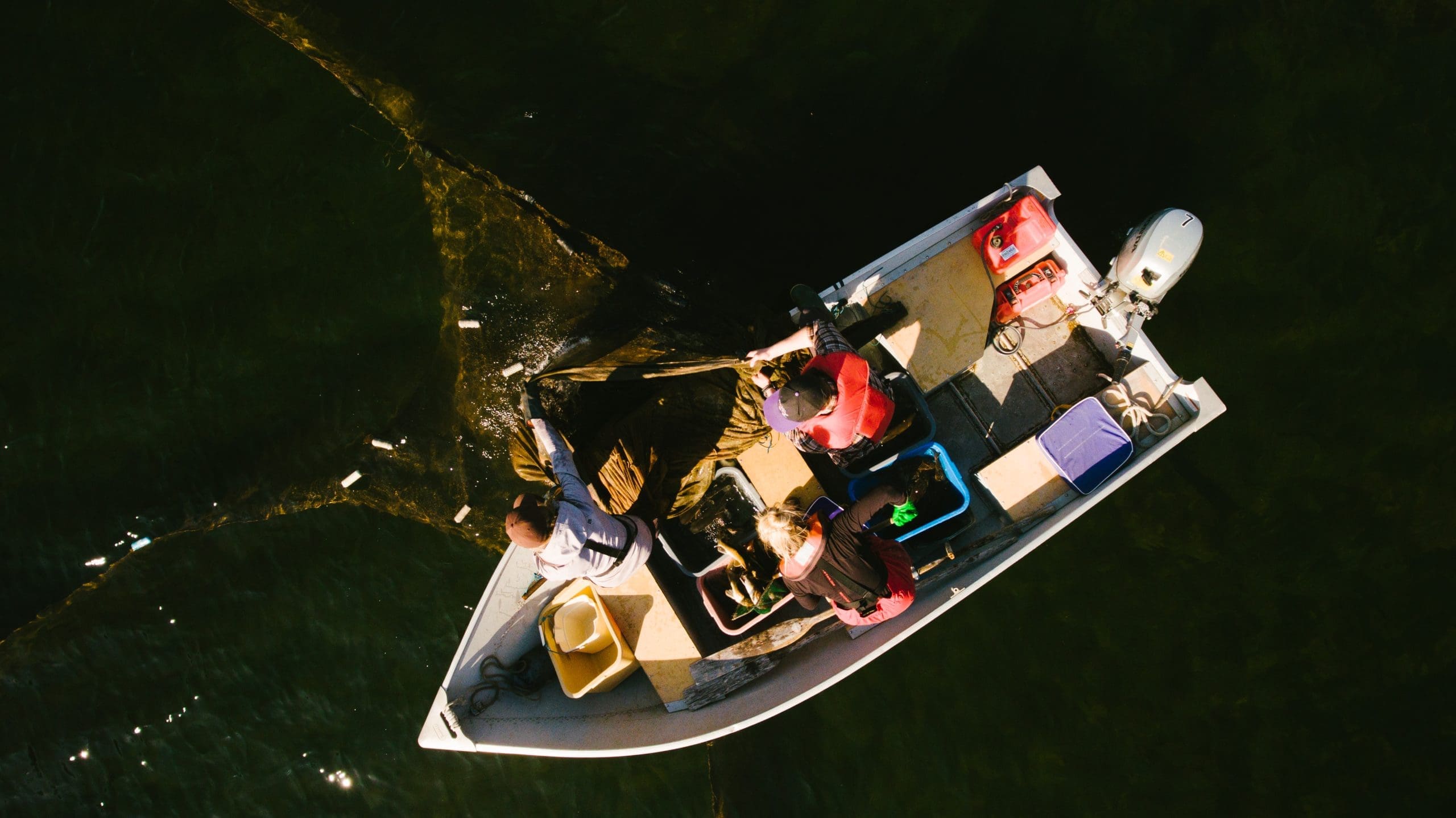 Working on a boat at IISD Experimental Lakes Area in Ontario